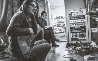 Steven Wilson with a guitar in the studio